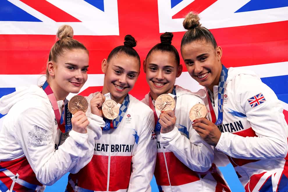 Great Britain’s Alice Kinsella, Jennifer Gadirova, Jessica Gadirova and Amelie Morgan celebrate with their bronze medals (Martin Rickett/PA)
