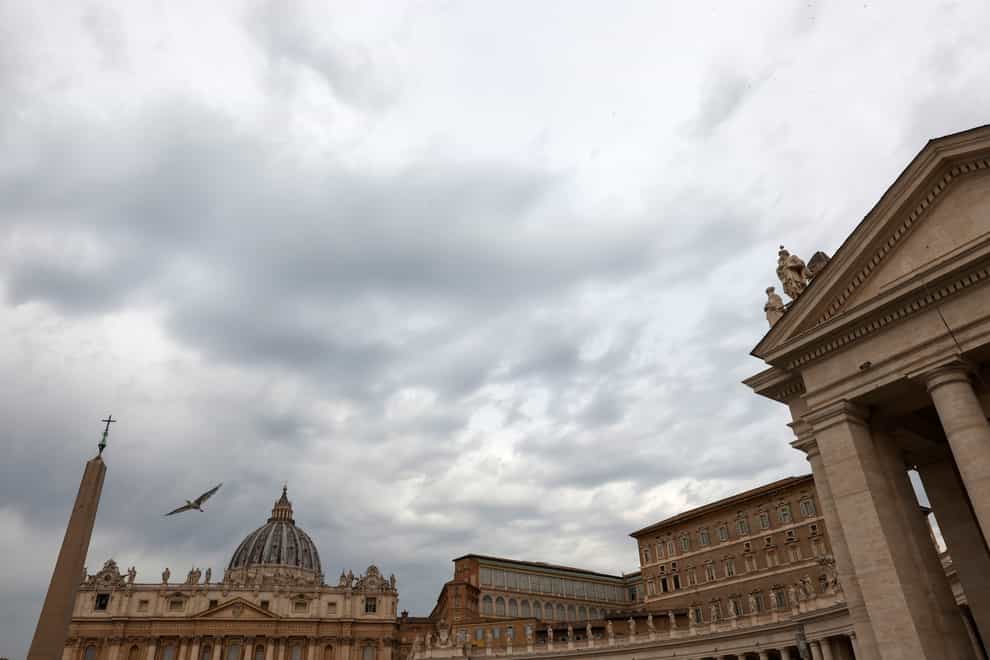 The sky above St. Peter’s Square at the Vatican, is overcast, on Tuesday, July 27, 2021. A trial is slated to begin on Tuesday within the Vatican City’s imposing walls of 10 defendants, including a once-powerful cardinal, in a case based on a sprawling probe into the allegedly criminal management of the Holy See’s portfolio of assets, including donations by countless Catholics from the pews. (AP Photo/Riccardo De Luca)