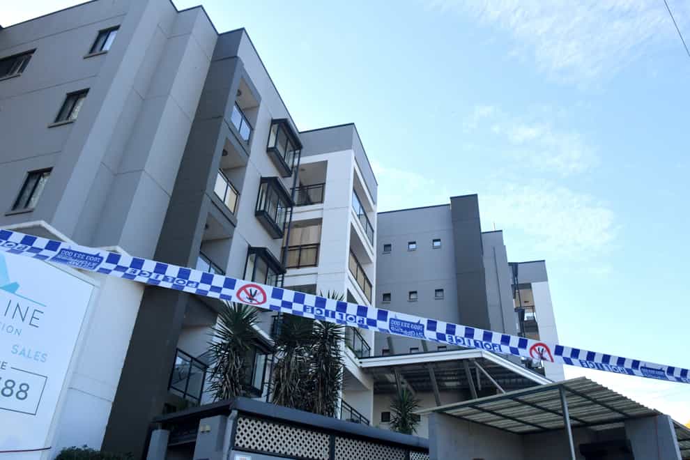Police tape is seen at a lock-downed apartment building in the south western suburb of Blacktown in Sydney (Mick Tsikas/AAP Image via AP)