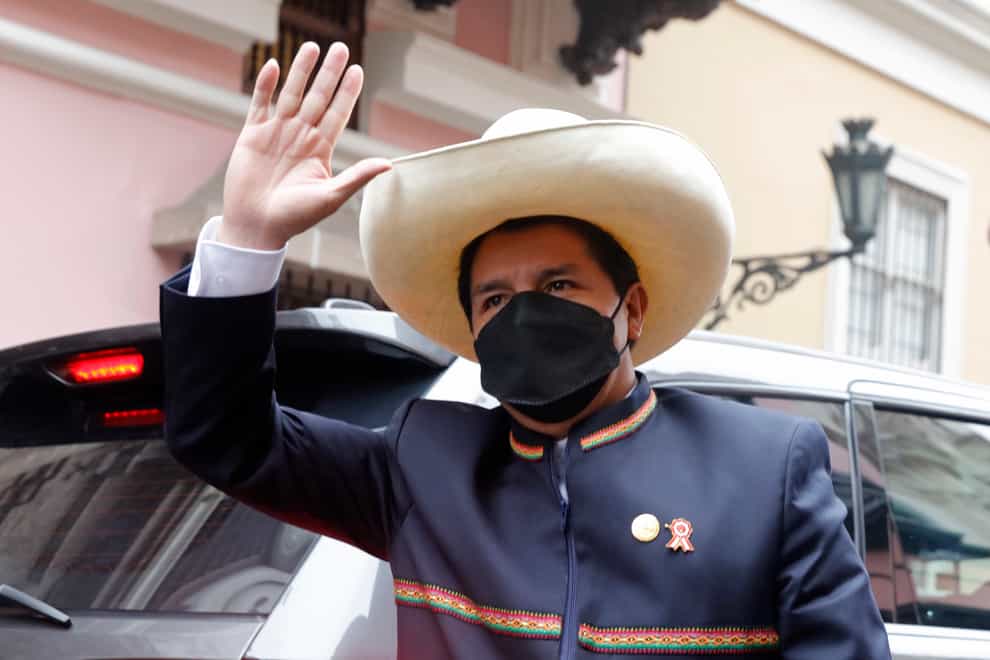 Pedro Castillo arrives to the Foreign Ministry before going to Congress for his swearing-in, on his Inauguration Day in Lima, Peru, Wednesday, July 28, 2021. (AP Photo/Guadalupe Pardo)