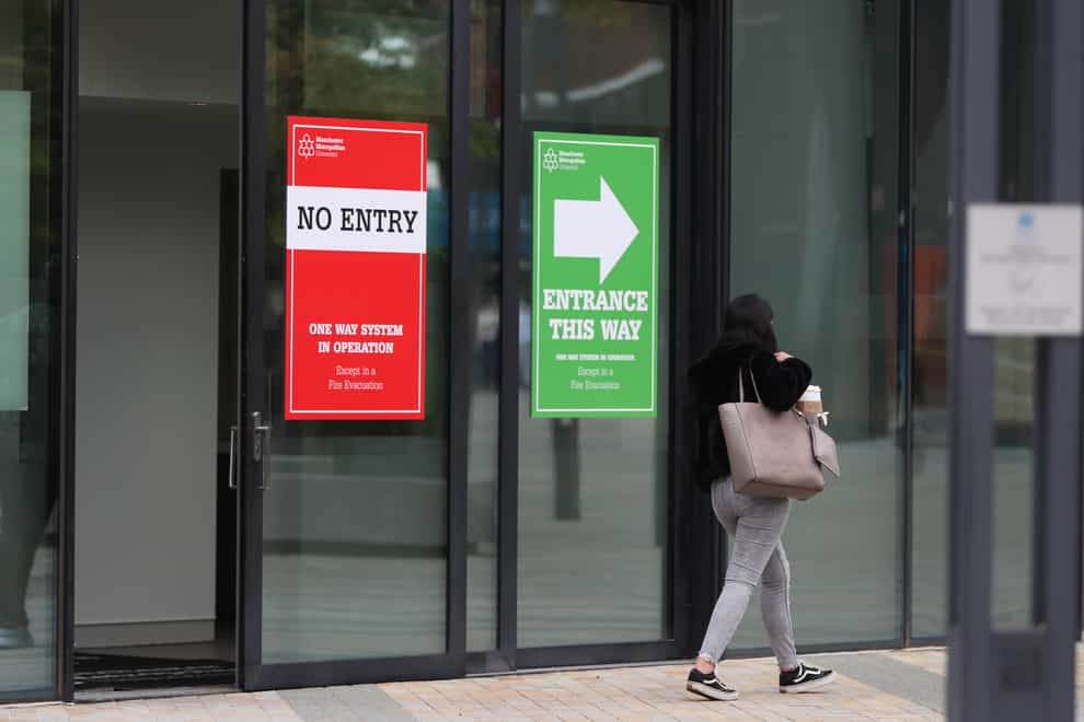 Signs on a window at Manchester Metropolitan University (PA)