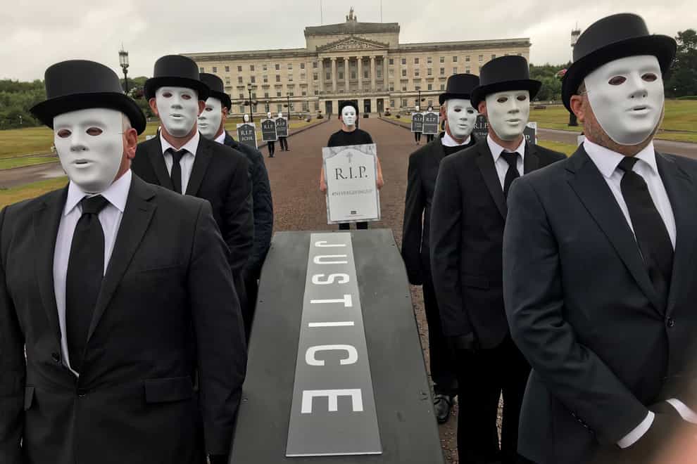 Victims hold a staged funeral procession at Stormont in protest at Government plans over legacy in Northern Ireland (Jonathan McCambridge/PA)