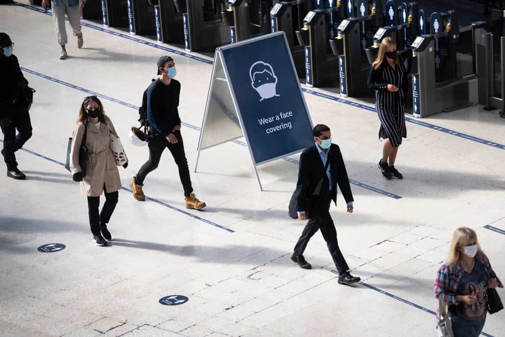 Passengers wearing face masks at Waterloo station in London (Victoria Jones/PA)
