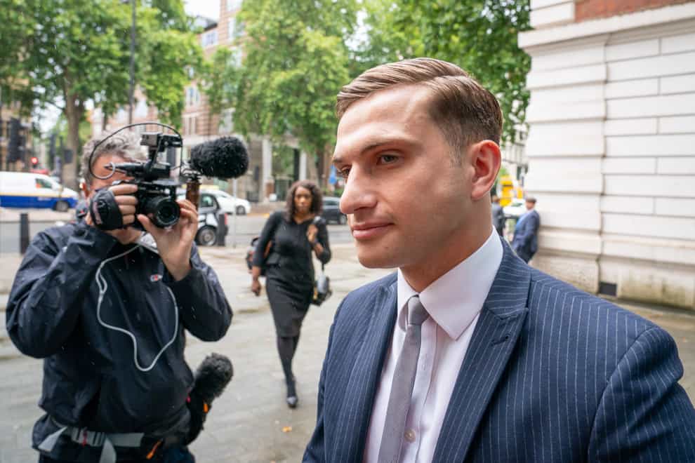 Lewis Hughes, 23, arrives at Westminster Magistrates’ Court in London, where he is charged with common assault, after the Chief Medical Officer for England Chris Whitty, was accosted in St James’s Park, central London, on Sunday June 27. Picture date: Friday July 30, 2021.