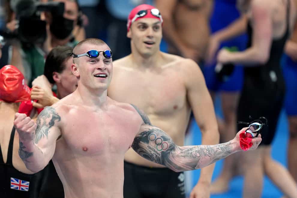 Great Britain’s Adam Peaty and James Guy celebrate winning the Mixed 4×100 metres medley relay at Tokyo Aquatics Centre (Joe Giddens/PA)