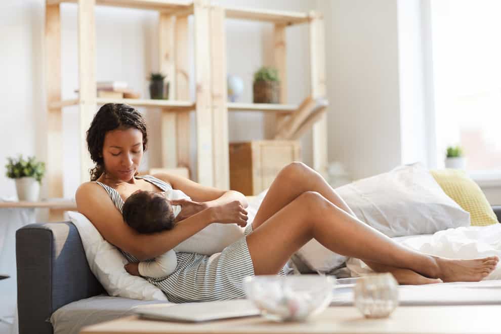 Breastfeeding baby (Alamy/PA)