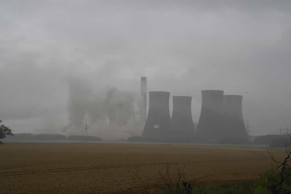 Four of the eight cooling towers at Eggborough power station are demolished by explosives (Peter Byrne/PA)
