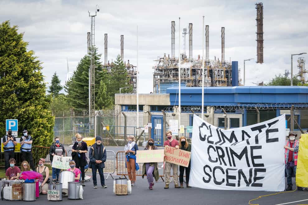 Climate activists demonstrating outside the gates of the Mossmorran chemical plant in Fife (Jane Barlow/PA)