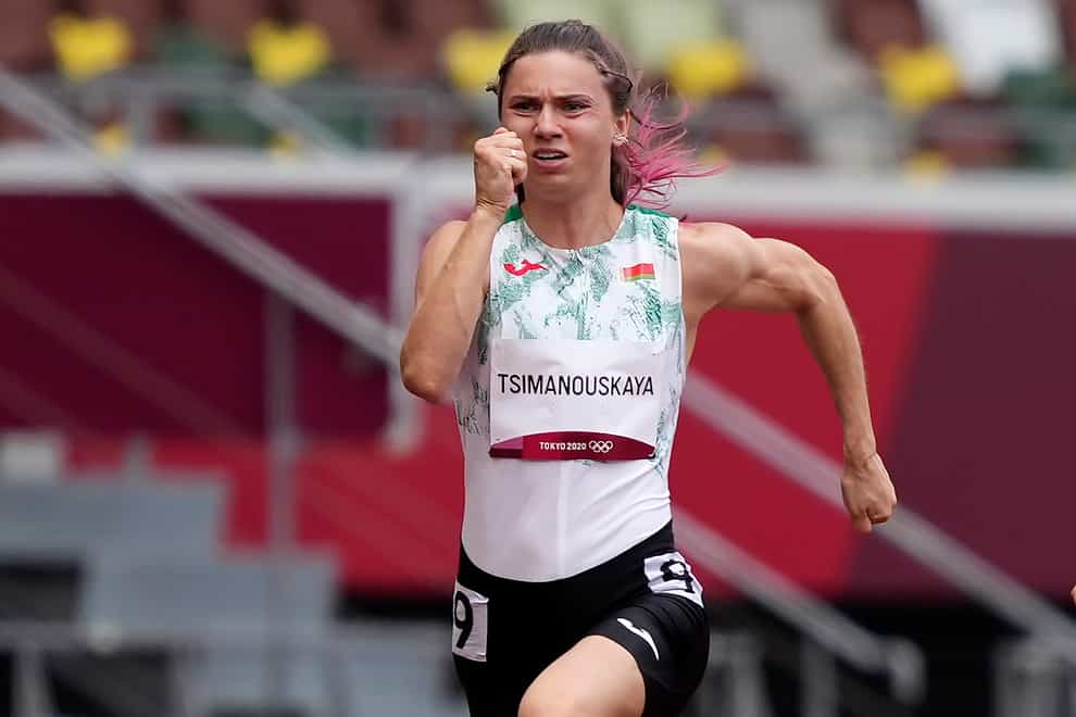 Krystsina Tsimanouskaya, of Belarus, runs in the women’s 100-meter run at the 2020 Summer Olympics, Friday, July 30, 2021. Tsimanouskaya alleged her Olympic team tried to remove her from Japan in a dispute that led to a standoff Sunday, Aug. 1, at Tokyo’s main airport. An activist group supporting Tsimanouskaya said she believed her life was in danger in Belarus and would seek asylum with the Austrian embassy in Tokyo. (AP Photo/Martin Meissner)