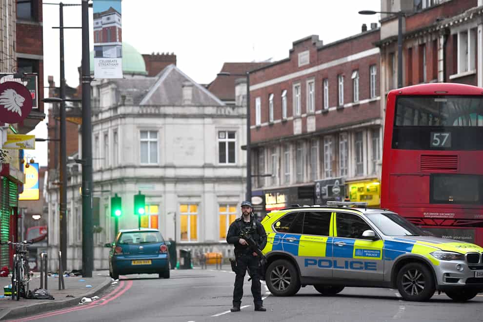Armed police at the scene in Streatham High Road, south London, after a man was shot dead by armed officers (Victoria Jones/PA)