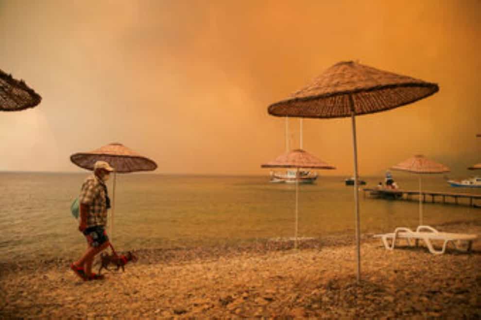 Wildfires near the beach in Bodrum, Turkey (Emre Tazegul/AP)
