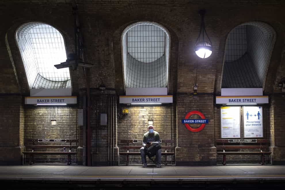 A man wearing a face mask in Baker Street Tube station in London (Victoria Jones/PA)
