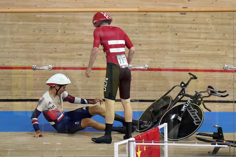 Great Britain’s Charlie Tanfield lies on the track after being shunted off it by Denmark’s Frederik Madsen in the men’s team pursuit (Danny Lawson/PA Images).
