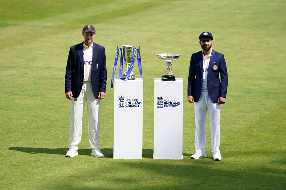 England’s Joe Root, left, and India’s Virat Kohli pose with the series trophies (Zac Goodwin/PA)