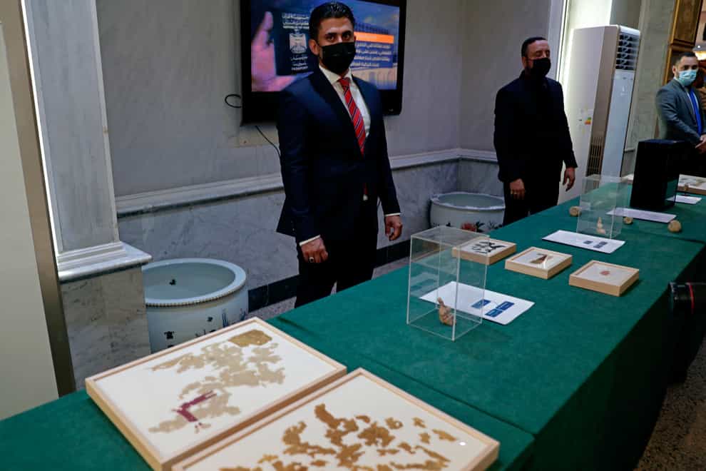 Recently recovered antiquities are displayed at the foreign ministry, in Baghdad, Iraq, Tuesday, Aug. 3, 2021. Over 17,000 looted ancient artefacts recovered from the United States and other countries were handed over to Iraq’s Culture Ministry on Tuesday, a restitution described by the government as the largest in the country’s history. The majority of the artefacts date back 4,000 years to ancient Mesopotamia and were recovered from the U.S. in a recent trip by Prime Minister Mustafa al-Kadhim. (AP Photo/Khalid Mohammed)