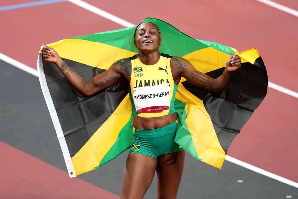 Jamaica’s Elaine Thompson-Herah, who has won the 100m and 200m double, celebrates in the Olympic Stadium