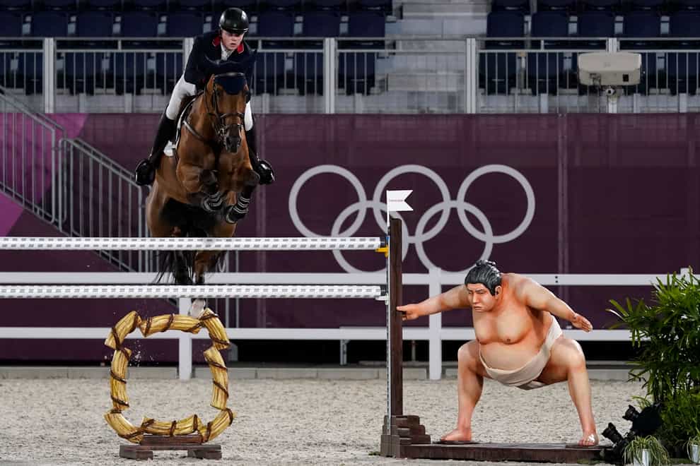Britain’s Harry Charles, riding Romeo 88, competes during the equestrian jumping individual qualifying at Equestrian Park in Tokyo at the 2020 Summer Olympics, Tuesday, Aug. 3, 2021, in Tokyo, Japan. (AP Photo/Carolyn Kaster)