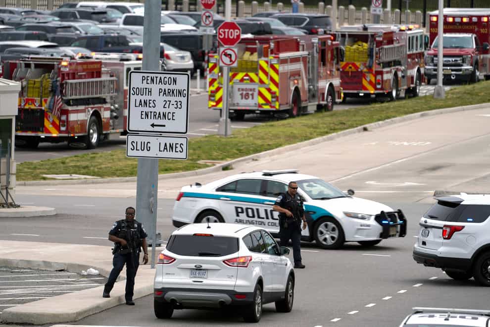Emergency vehicles are seen outside the Pentagon Metro area Tuesday, Aug. 3, 2021, at the Pentagon in Washington. The Pentagon is on lockdown after multiple gunshots were fired near a platform by the facility’s Metro station. (AP Photo/Andrew Harnik)
