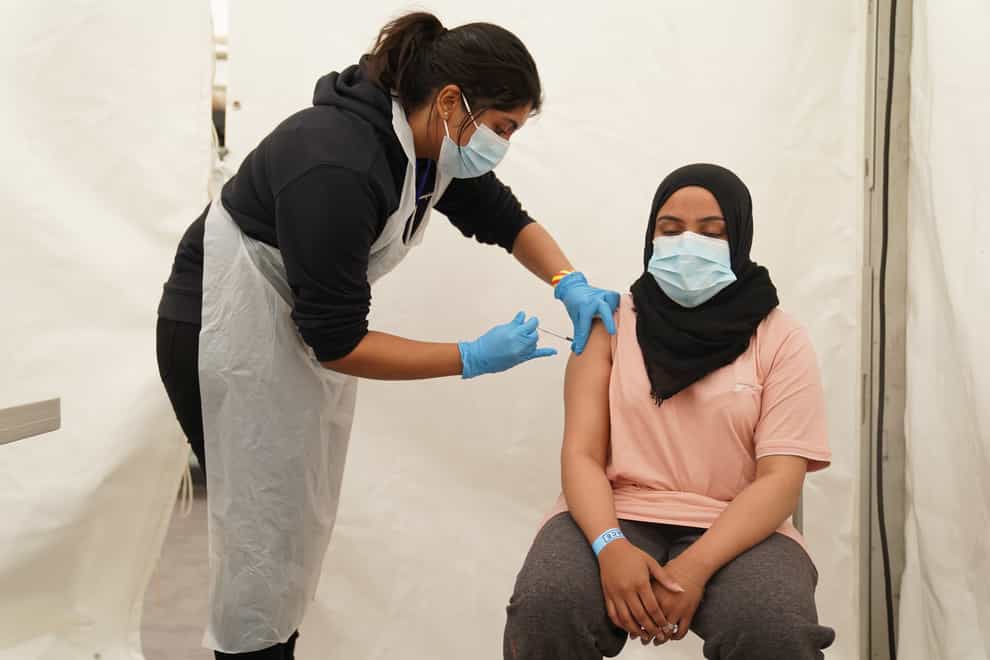 A person receives a Covid-19 vaccine at a pop-up vaccination centre during a four-day vaccine festival in Langdon Park, Poplar, east London (Kirsty O’Connor/PA)