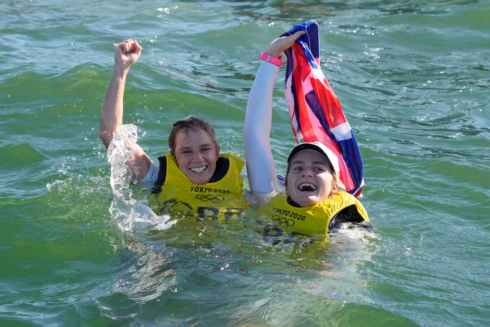 Hannah Mills and Eilidh McIntyre celebrate after winning the women’s 470 race (Gregorio Borgia/AP)