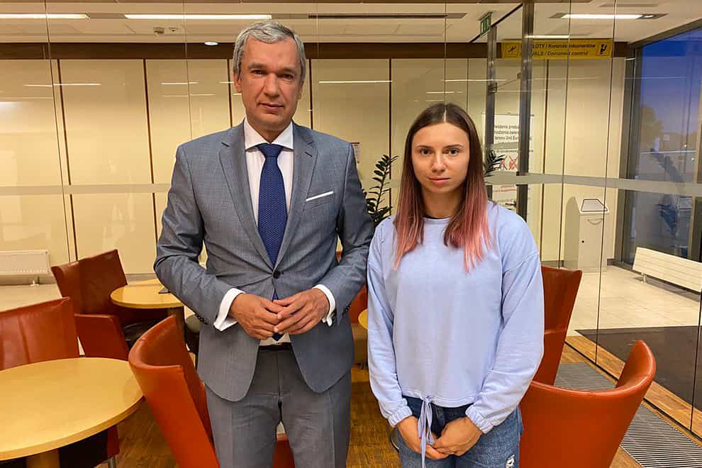 Belarusian Olympic sprinter Krystsina Tsimanouskaya, right, who seeks foreign refuge from Minsk authorities, poses with top Belarusian dissident in Poland, Pavel Latushko, left (National Anti-crisis Management via AP)