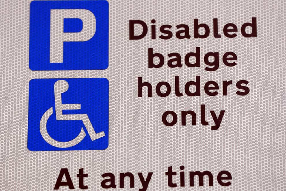 Measures are being introduced to tackle issues faced by disabled motorists applying for blue badge permits (Jonathan Brady/PA)