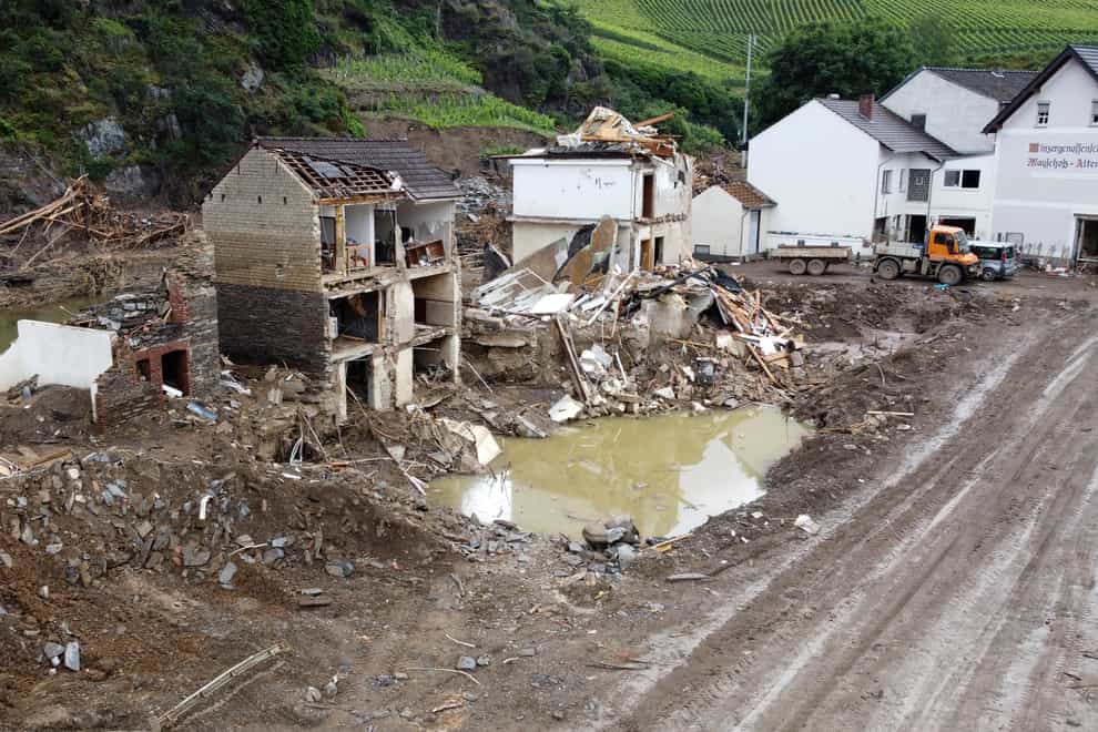 People’s homes were destroyed after flood water ripped through a village (Thomas Frey/dpa via AP)