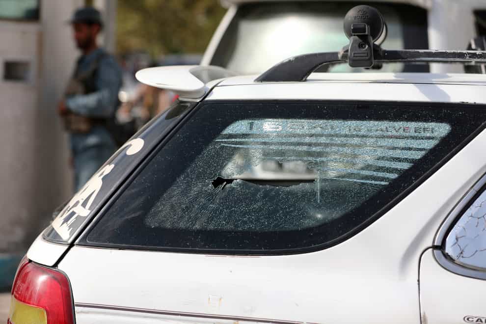 A bullet hole is seen in the vehicle in which director of Afghanistan’s Government Information Media Centre was shot dead in Kabul (Rahmat Gul/AP)
