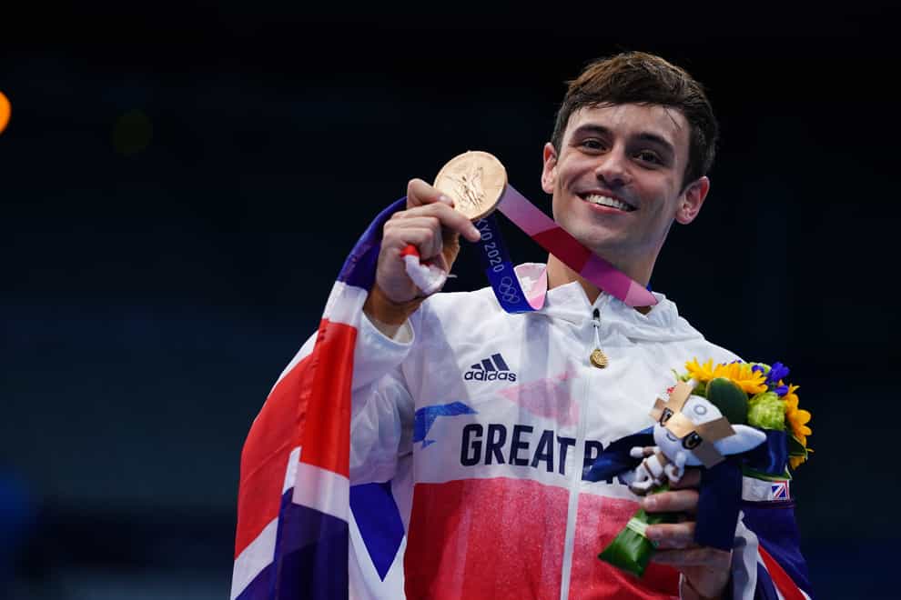 Tom Daley with a bronze medal (PA)