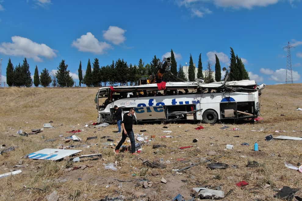 Officials investigate at the site of a bus crash in Balikesir, western Turkey (IHA/AP)