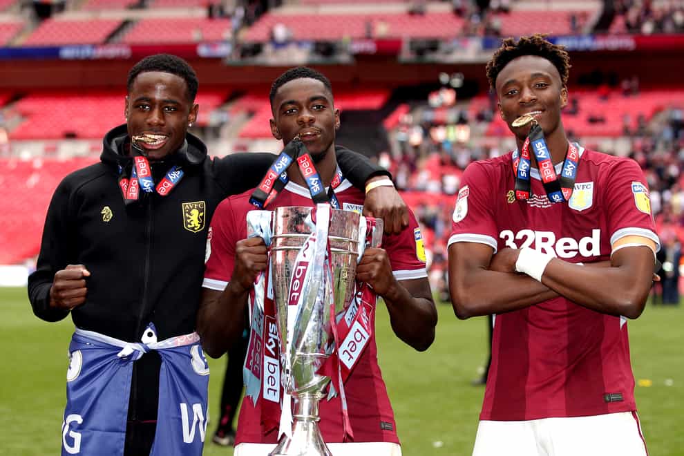 Manchester United defender Axel Tuanzebe, centre, helped Aston Villa reach the Premier League in 2019 and will have a second loan spell at the club (John Walton/PA)