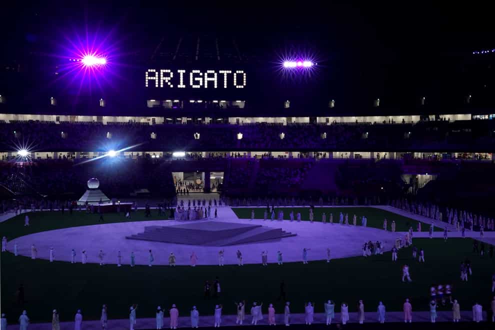 The word “Arigato” written in lights during the closing ceremony of the Tokyo 2020 Olympic Games (Martin Rickett/PA)