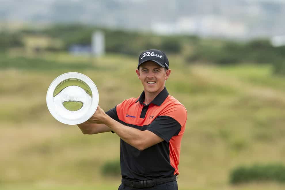 Grant Forrest holds the trophy on the 18th after winning the Hero Open at Fairmont St Andrews (Ian Rutherford/PA)