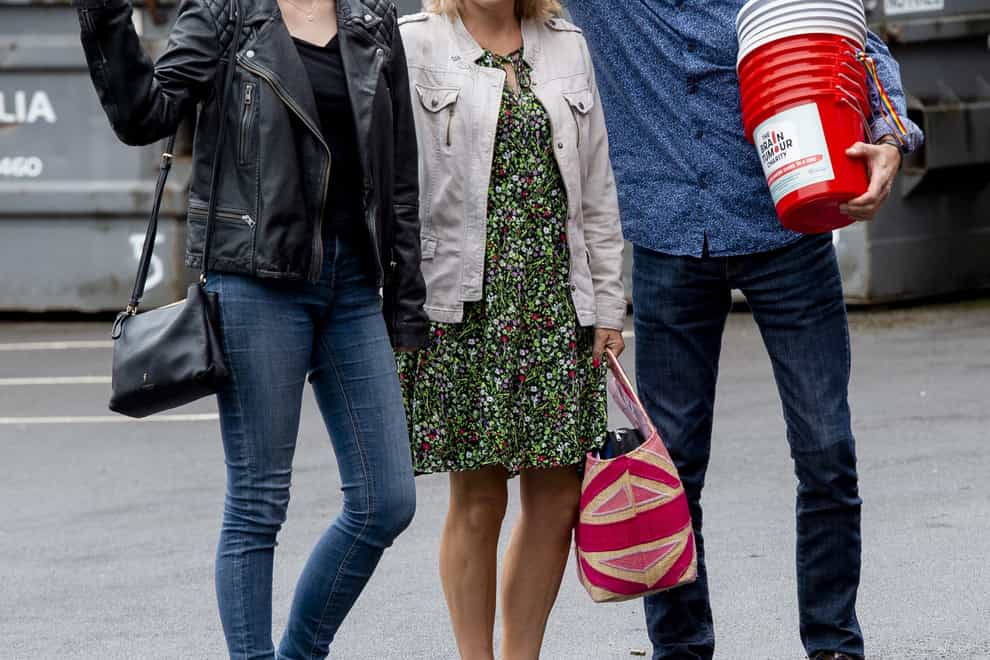 Laura Nuttall (left) with her mum Nicola and dad Mark arrive at Peter Kay’s charity show (Peter Powell/PA)