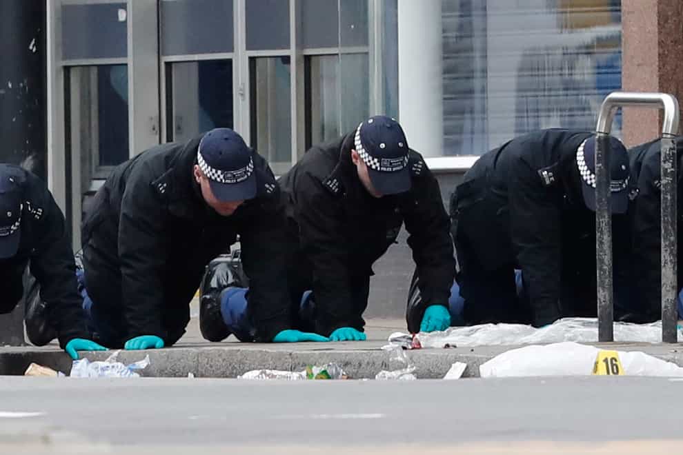 Police conduct a finger tip search following the terror attack in Streatham High Road, south London by Sudesh Amman, 20, who was shot dead by armed police following what police declared as a terrorist-related incident (PA)
