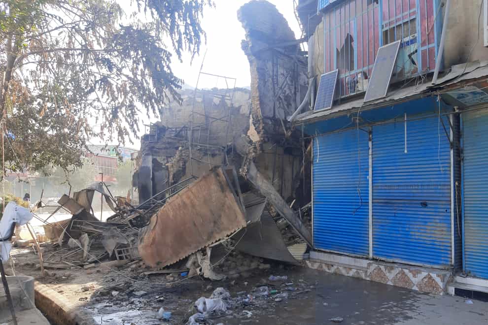 Shops are damaged after fighting between Taliban and Afghan security forces in Kunduz city, northern Afghanistan (Abdullah Sahil/AP)
