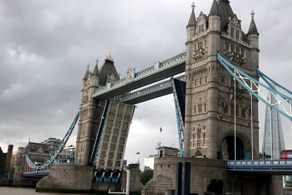 Tower Bridge in central London, which has been left open due to a technical fault, causing traffic problems in central London this afternoon. Picture date: Monday August 9, 2021.