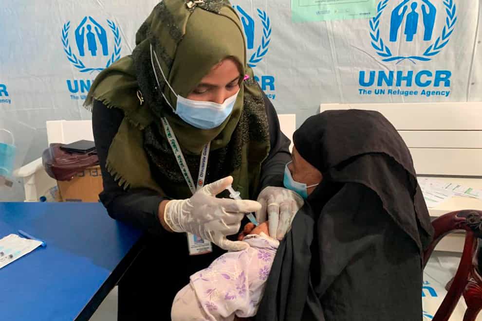 A Rohingya refugee gets vaccinated against Covid-19 in Cox’s Bazar, Bangladesh (Shafiqur Rahman/AP)