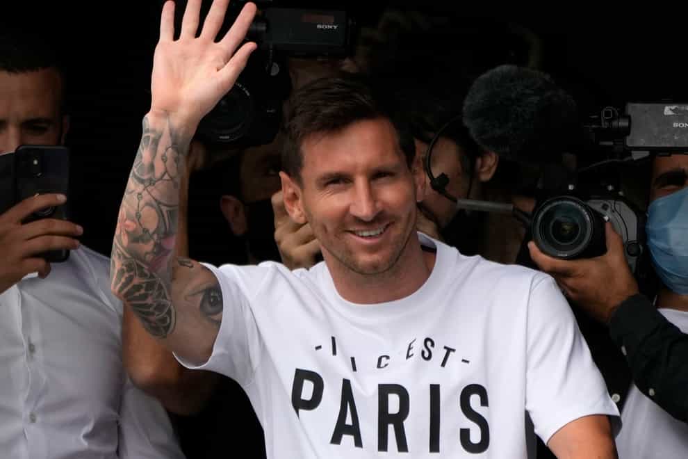 Lionel Messi waves after arriving at Le Bourget airport, north of Paris (Francois Mori/AP).