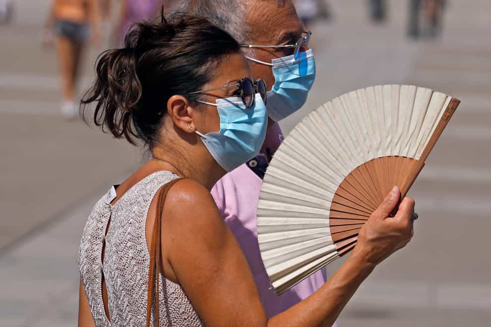 A heat wave is expected to bring scorching temperatures and the threat of wildfires to Spain and Portugal (Paul White/AP)