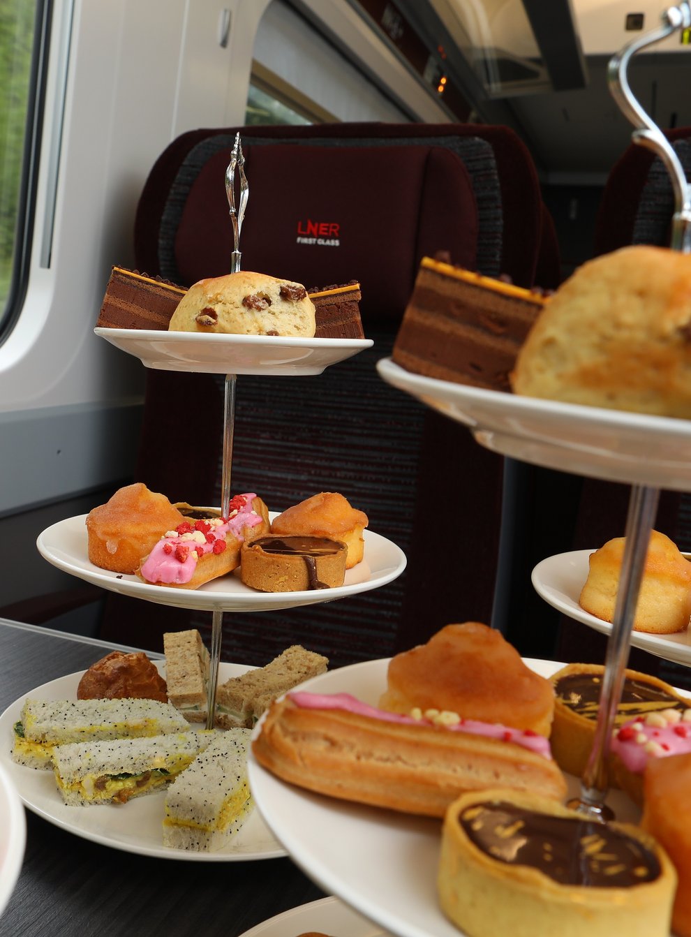 Afternoon tea was served on a train as part of efforts to encourage more people to return to rail travel (LNER/PA)