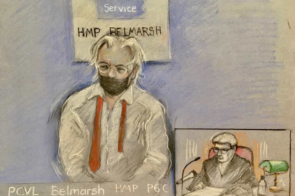 Court artist sketch by Elizabeth Cook of Julian Assange appearing by video link at the High Court in London (PA)