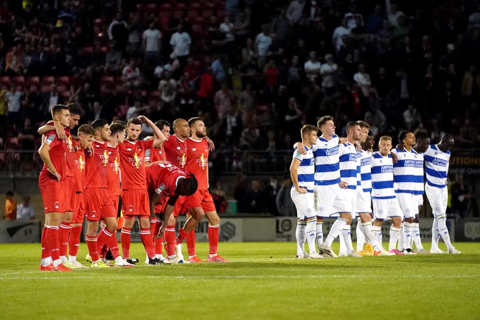 Leyton Orient and QPR players line up before taking penalties (Jonathan Brady/PA)