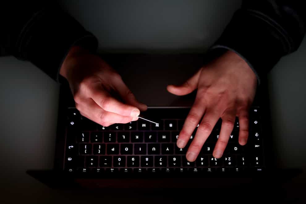 Ccyber crime has cost organisations more than £5 million in the past 13 months (Tim Goode/PA)