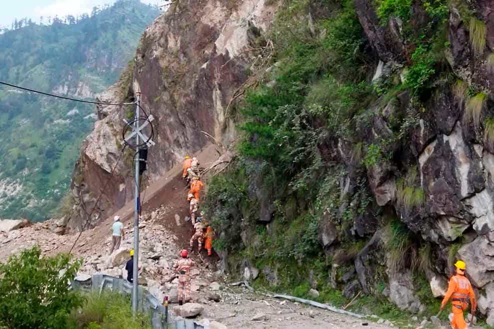 India’s National Disaster Response Force soldiers at the site of a landslide in Kinnaur district (National Disaster Response Force via AP)