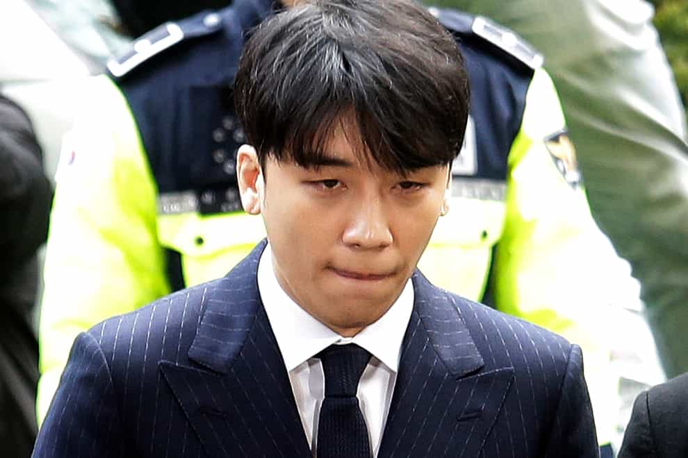 Seungri, a former member of a popular K-pop boy band Big Bang, arrives at the Seoul Metropolitan Police Agency (Ahn Young-joon/AP)