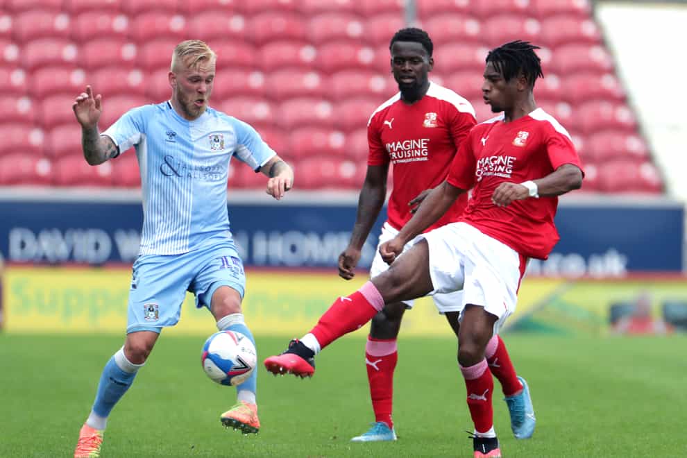 Akin Odimayo, right, is fit enough to feature for Swindon (Bradley Collyer/PA)