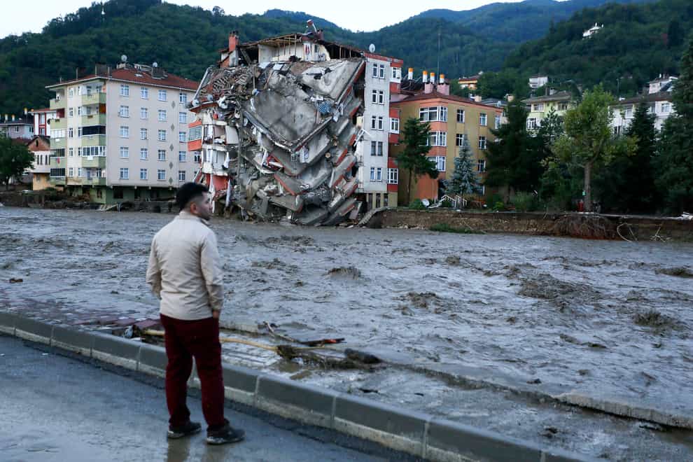 Flood waters sweep by in Bozkurt town, Kastamonu province (IHA/AP)