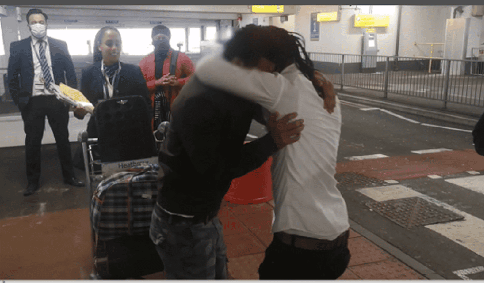 Eritrean teenage brothers Adi and Eyob hugging after being reunited at Heathrow Airport (Da’aro Youth Project/Benny Hunter/PA)