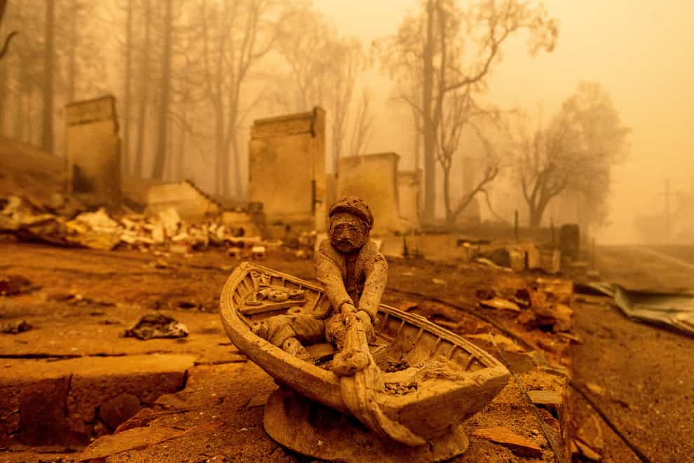 An ornament rests in front of a Greenville home destroyed by the Dixie Fire in Plumas County (Noah Berger/AP)